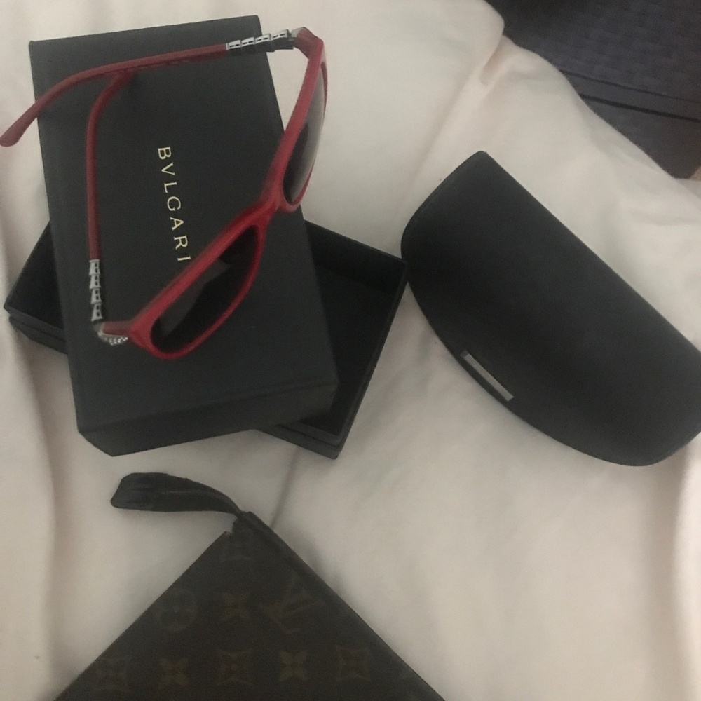Louie vuitton clutches  ,  Blvgari sun glasses